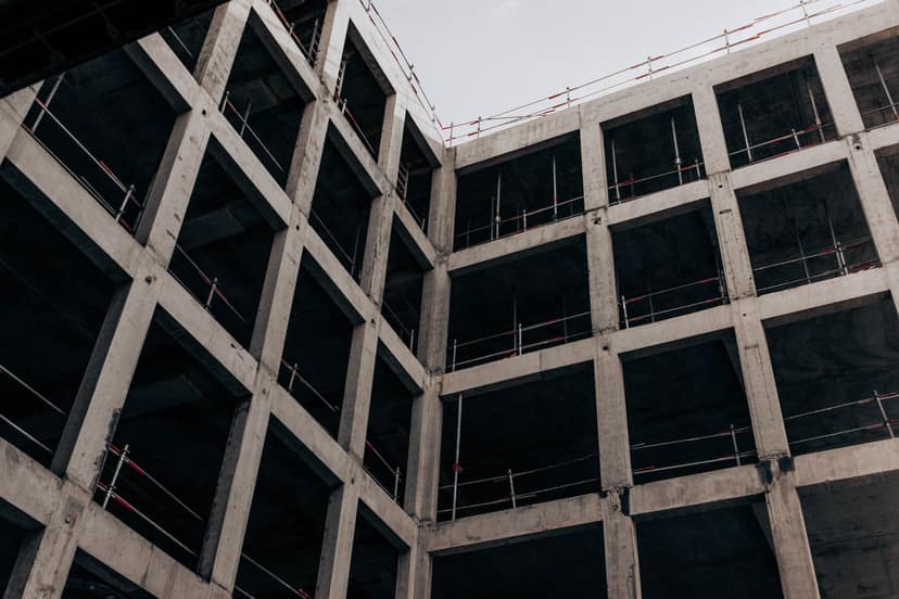The concrete frame of a commercial building, seen from below
