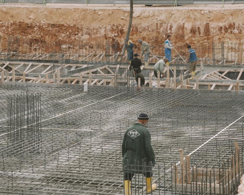 A crew working across a reinforced foundation