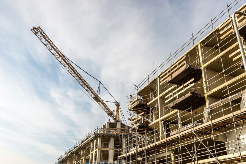 Crane beside a commercial building under construction